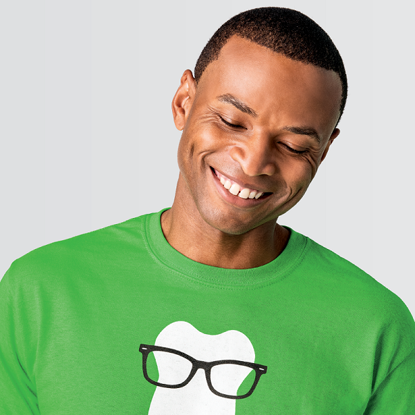 Man smiling in green Delta Dental of Illinois shirt 