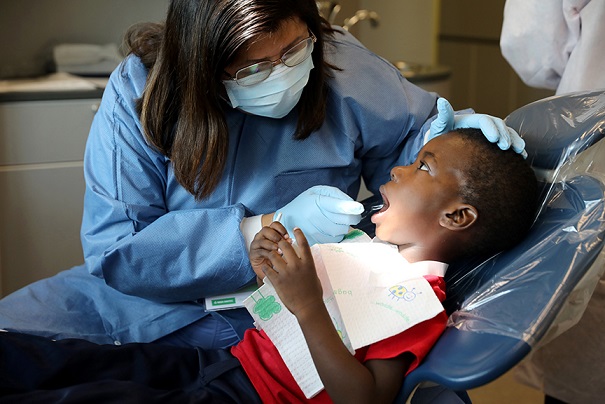 Dentist examining child patient 
