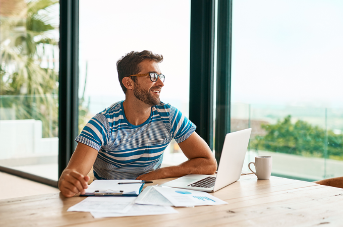 Man smiling at laptop