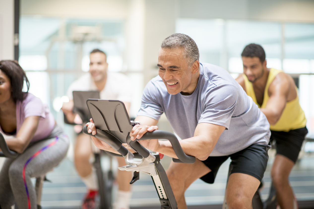 Man smiling and riding bike