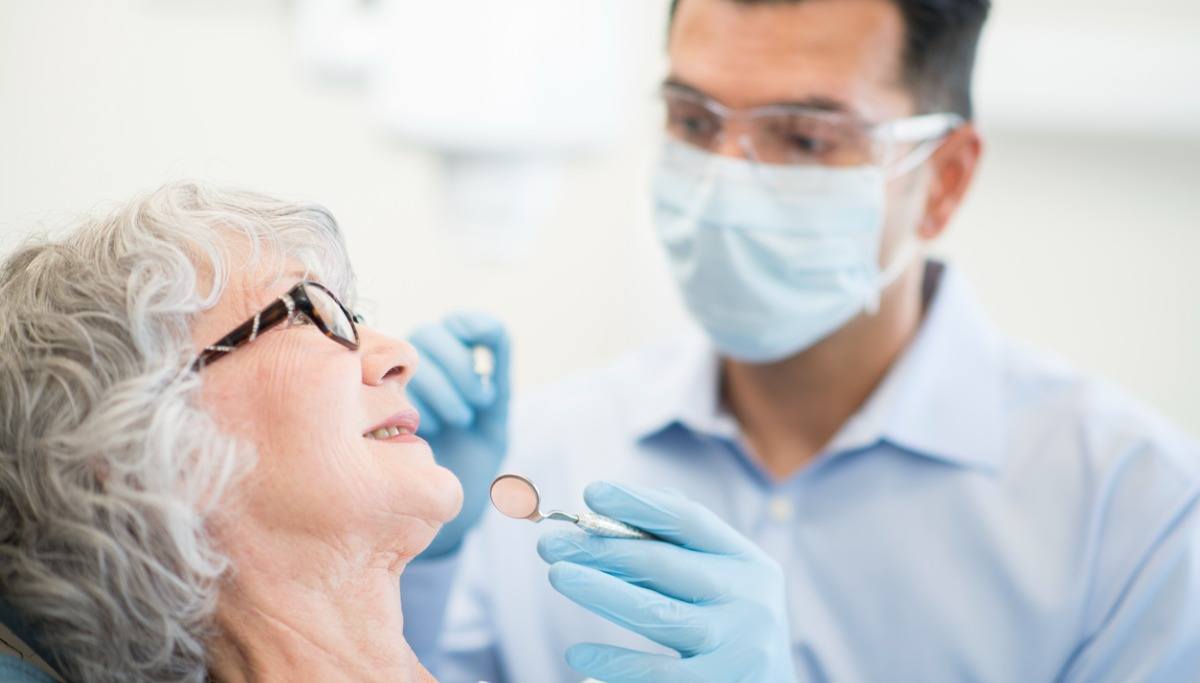 Dentist working with patient