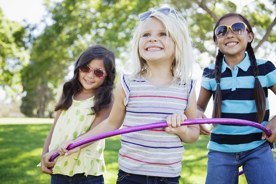kids outside with hulahoop