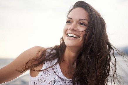 woman outdoors smiling