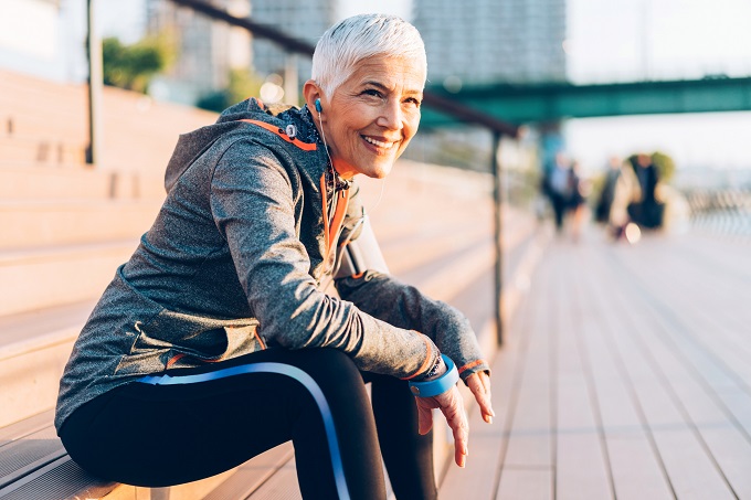 older woman outside in exercise clothes