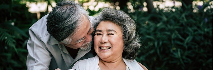 Older man and woman smiling