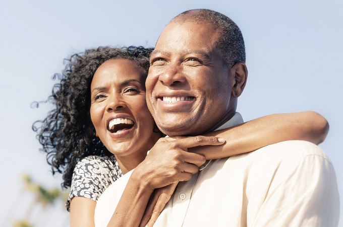 older adults african american woman and man smiling outside