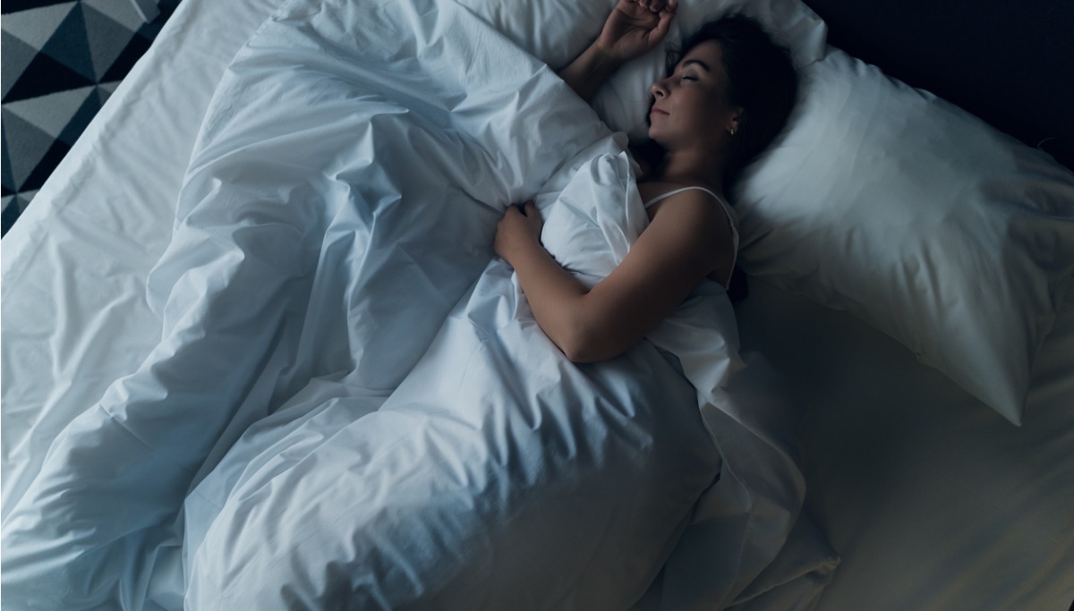 Woman sleeping in bed 