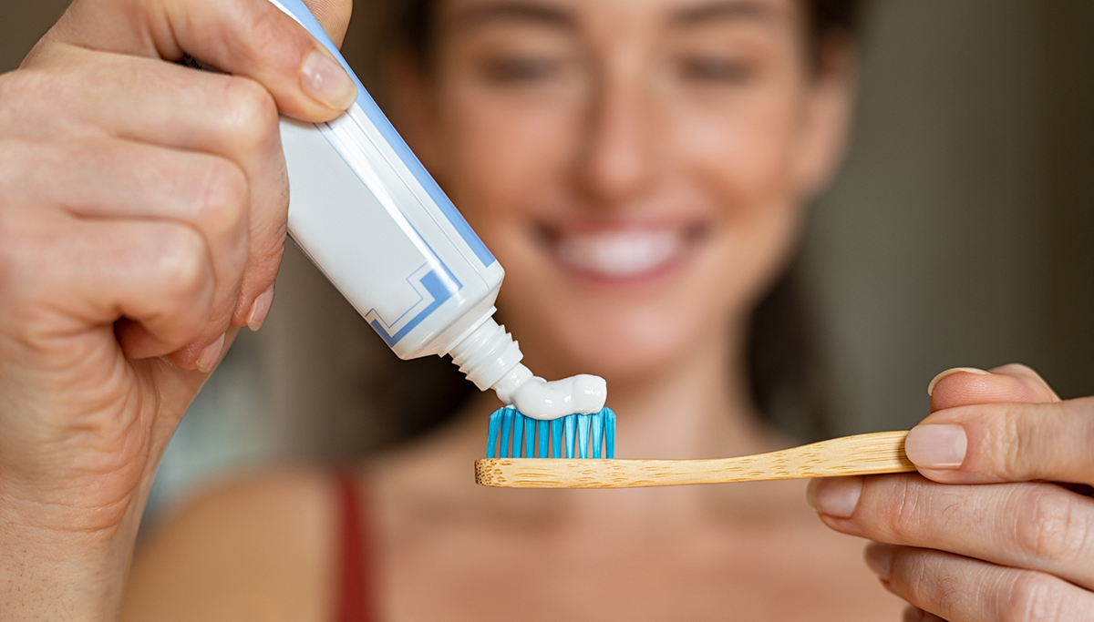 Woman holding toothbrush