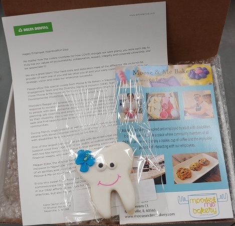 photo of tooth shaped cookie and letter and insert sent to employees of Delta Dental of Illinois