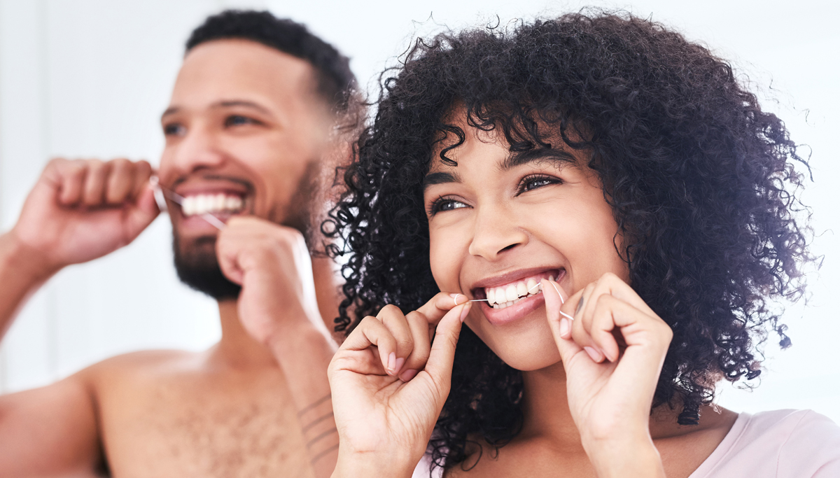 Couple flossing together 