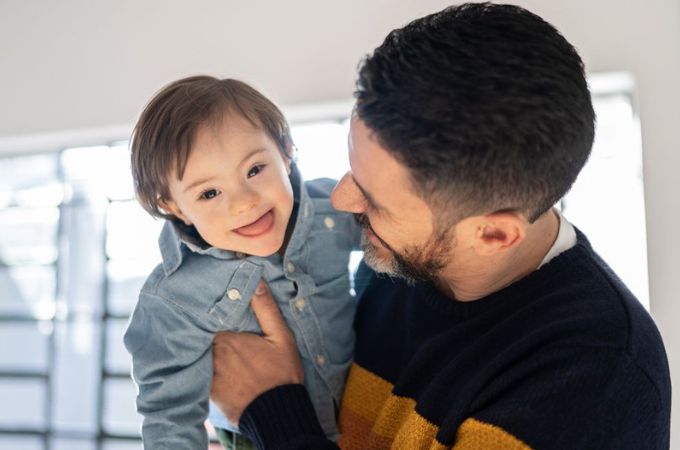 Father and son smiling