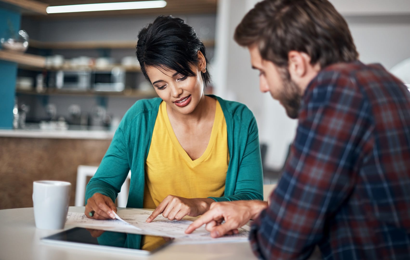 Two people reviewing work