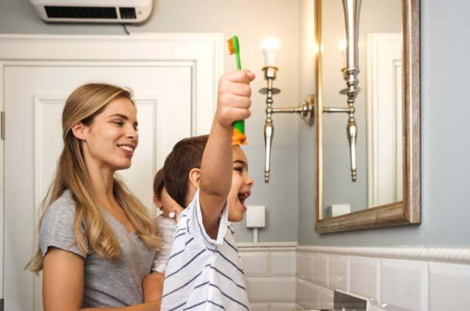 Children brushing teeth