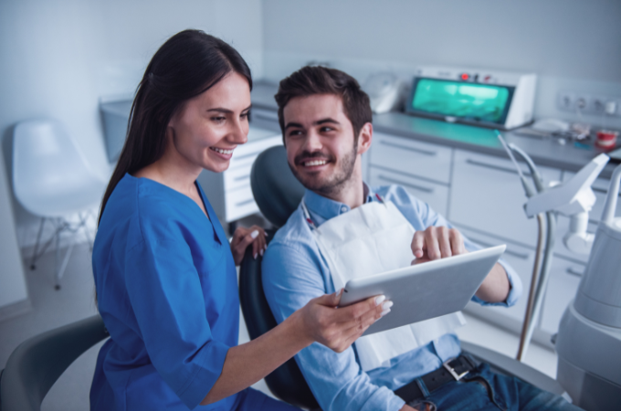 dentist and patient smiling