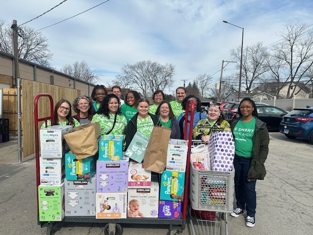 Employees smiling at volunteering event