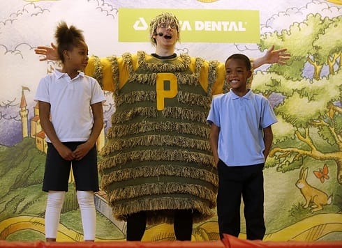 Students get an oral health lesson from Tooth Wizard