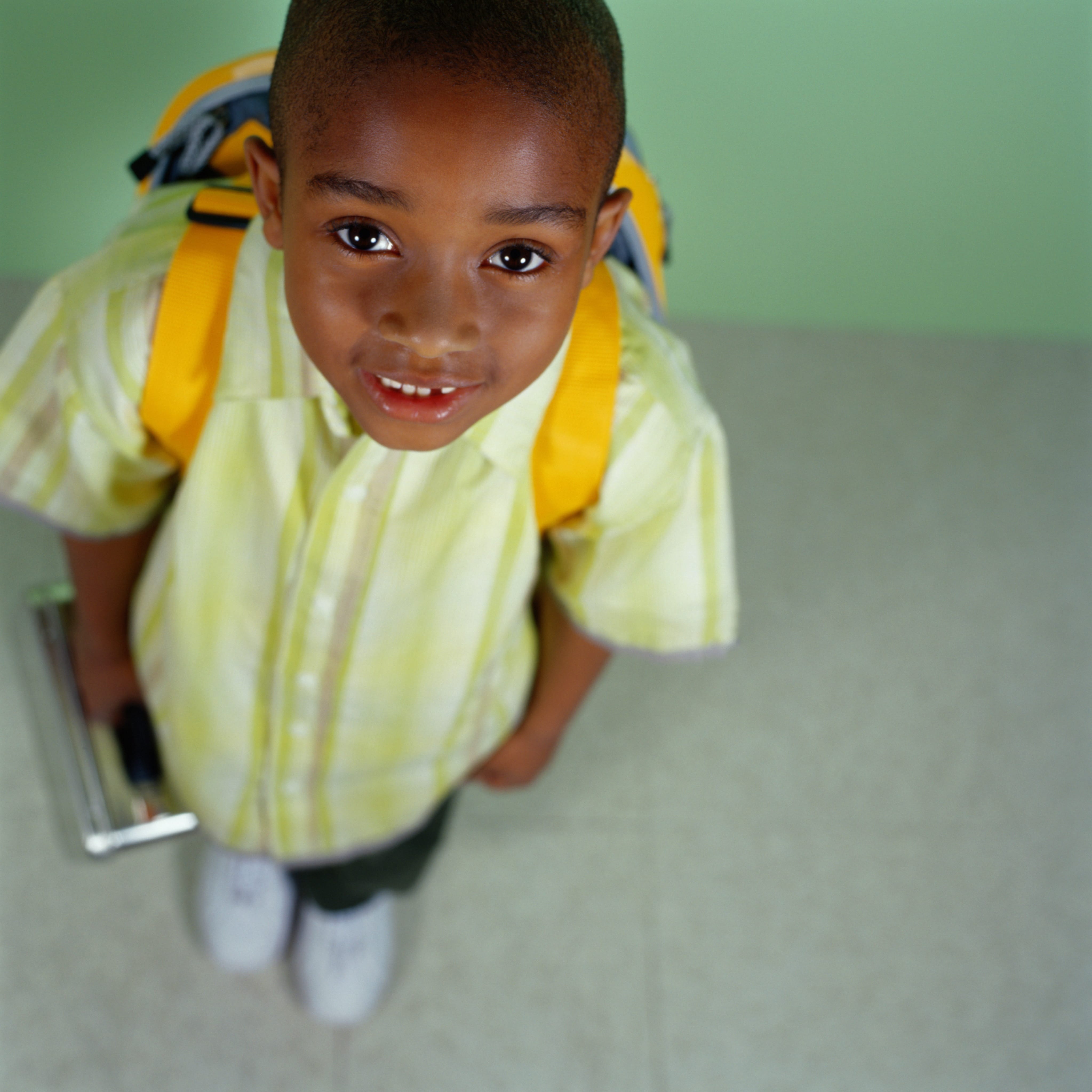 young boy with backpack ready for school
